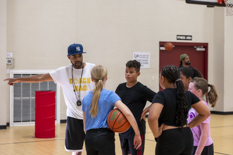 Coach Mac instructing athletes